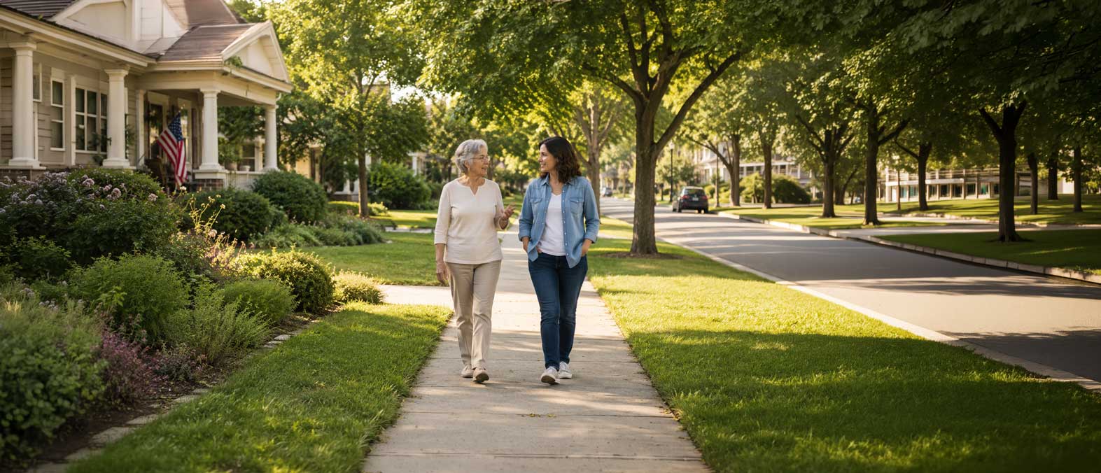 mother and adult daughter walking in a neighborhood
